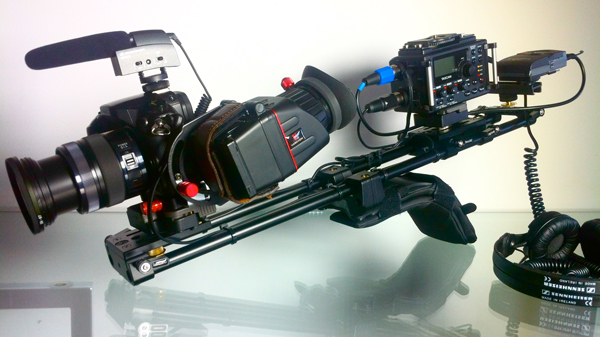 Shoulder rig for DSLR showing shoulder mounted camera support rig