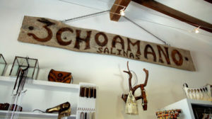 3choamano handmade leather sign hanging in the store