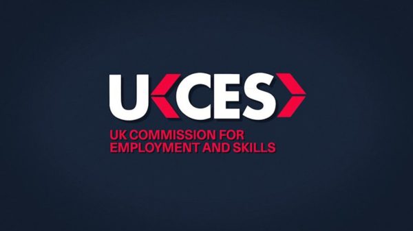 Filming interviews. UKCES red and white logo on dark blue background