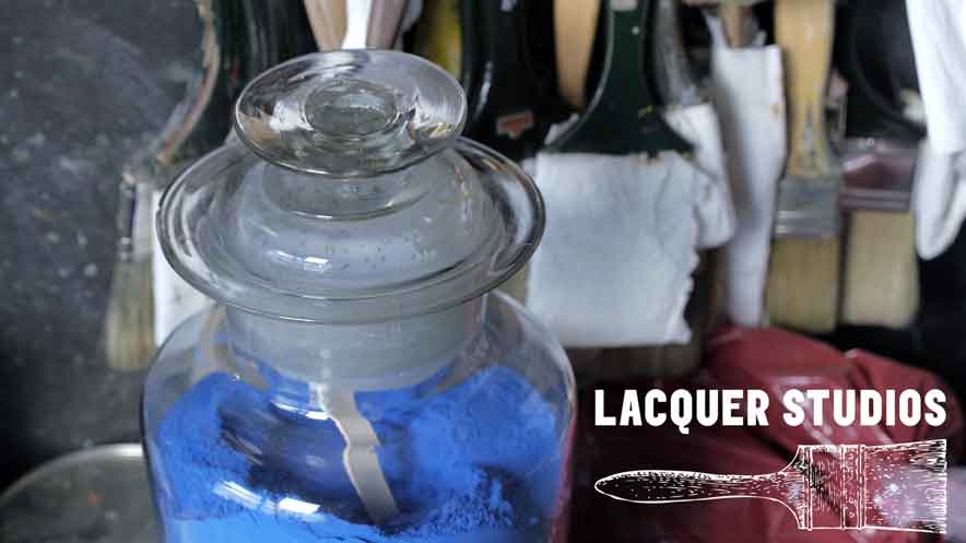Artists promotional video. White lacquer Studios logo over image from studio showing large glass jar of blue pigment