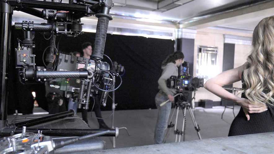 Freelance data wrangler showing filming with a Red Epic Dragon on set fitted into a stabiliser rig.