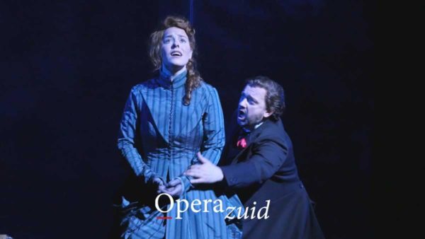 Opera videographer. Thumbnail shows two leading characters performing on stage in a light embrace.