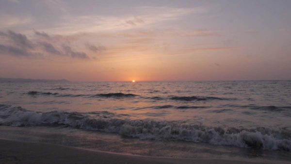 Dawn breaks over sea