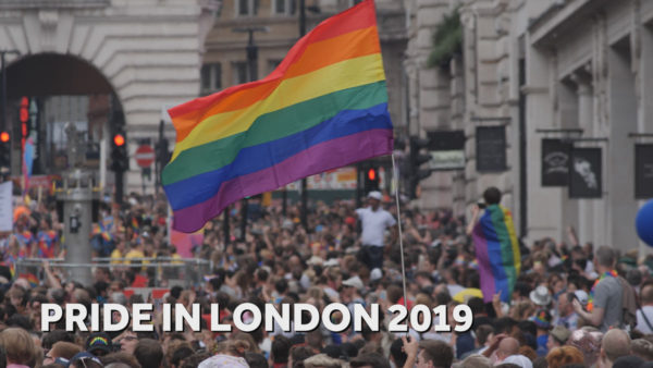 cameraman London showing rainbow flag and crowds