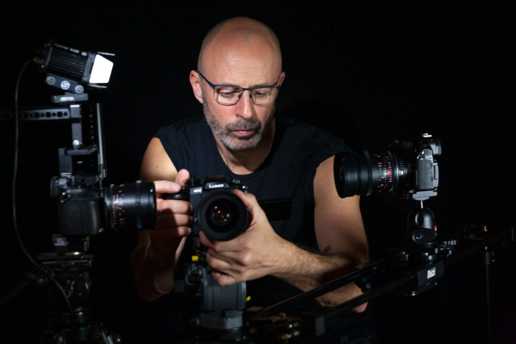 Freelance cameraman with three DSLR cameras