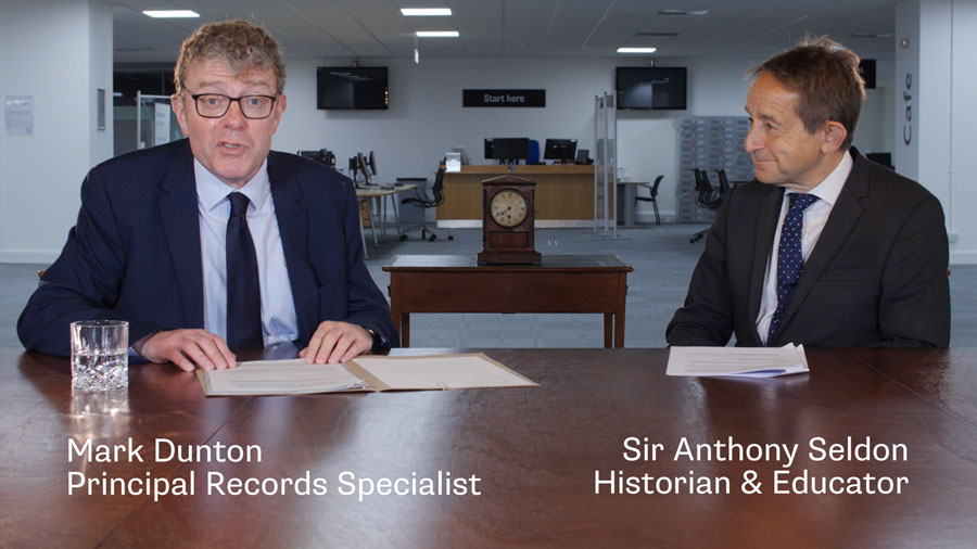 Mark-Dunton-and-Sir-Anthony-Seldon sit on the same side of a facsimile of the cabinet table.