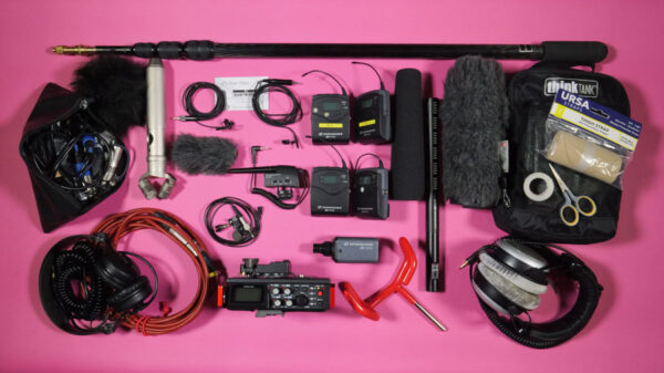 Sound recording for videographers showing a selection of sound recording equipment filmed on a bright pink background