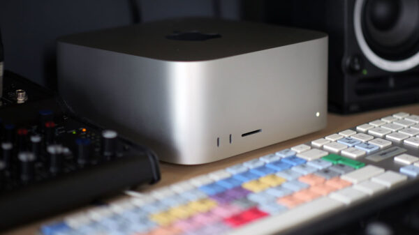 Video editing workstation upgrade showing new Mac Studio M4, Avid keyboard, audio mixer and speaker.