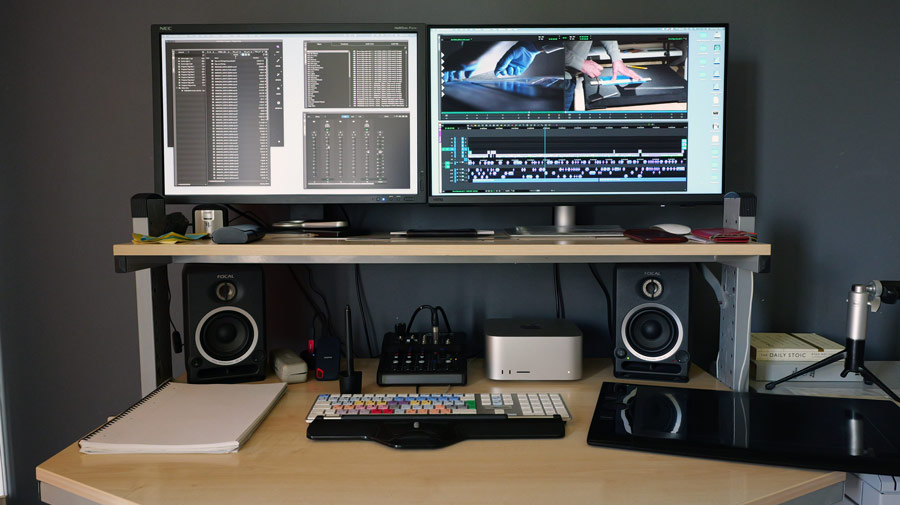 Video-editing-monitor-upgrade-showing-two-screen-based-workstation-against-a-grey-wall