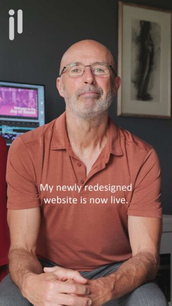 Julian-Langham- seated-looking-directly-at-camera-with-editing-workstation-behind
