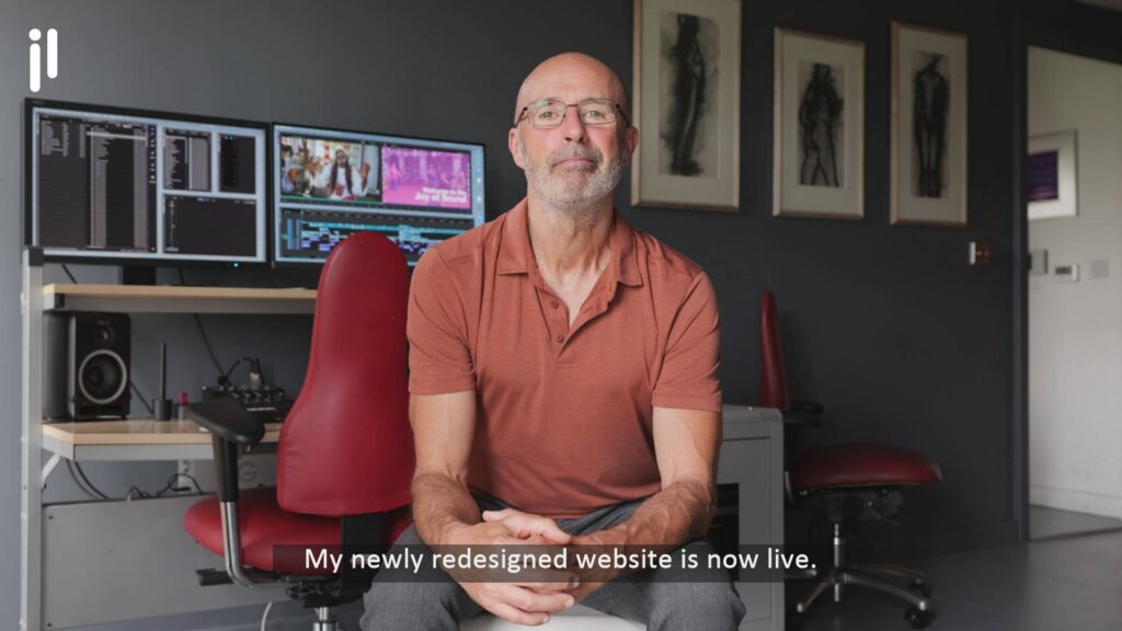 Julian-Langham-videographer--wide-shot-showing sitting-in-front-of-editing-workstation.