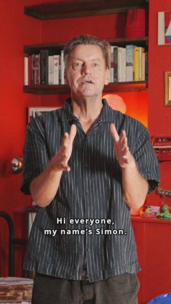 Simon Casson is standing and talking to the camera.