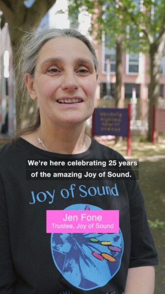 Documenting an anniversary showing a mid shot of Jen Fone JoS trustee with name text overlay and subtitles.